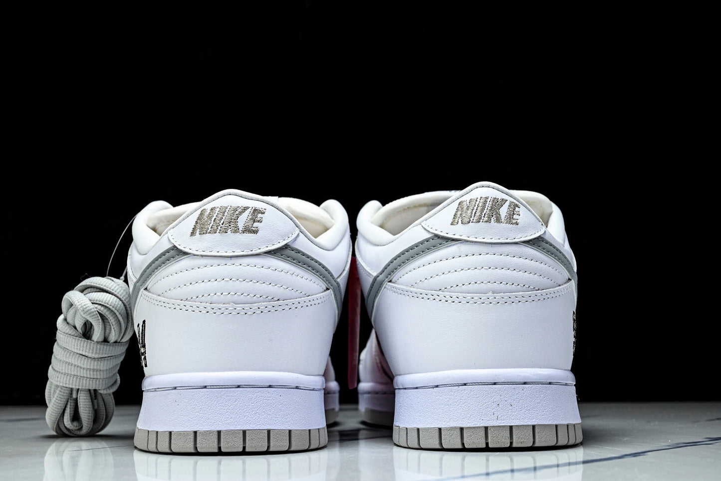 SB Dnk Low x Supreme 94 White Metallic Silver